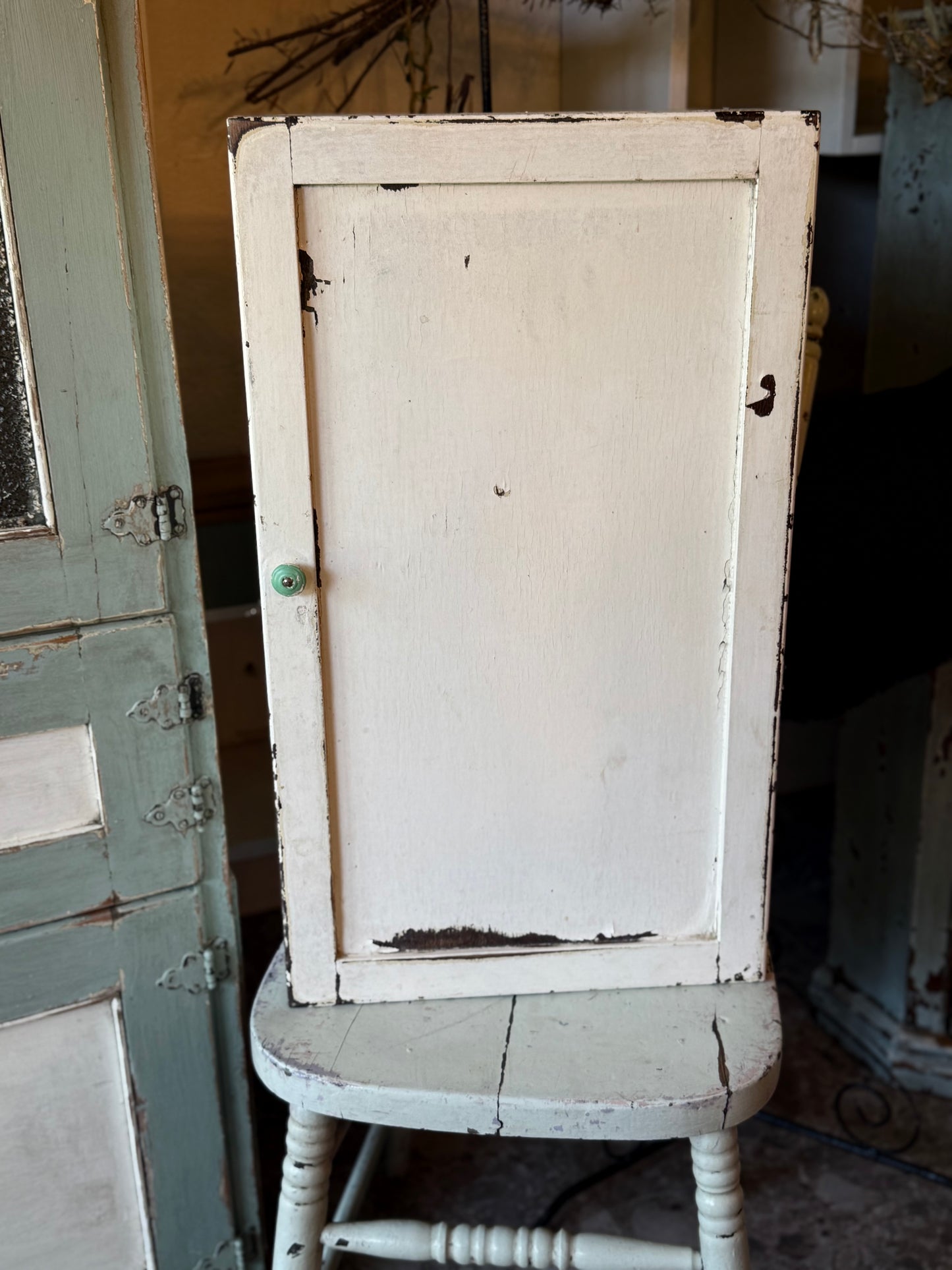 Old White Wall Cabinet with Green Handle