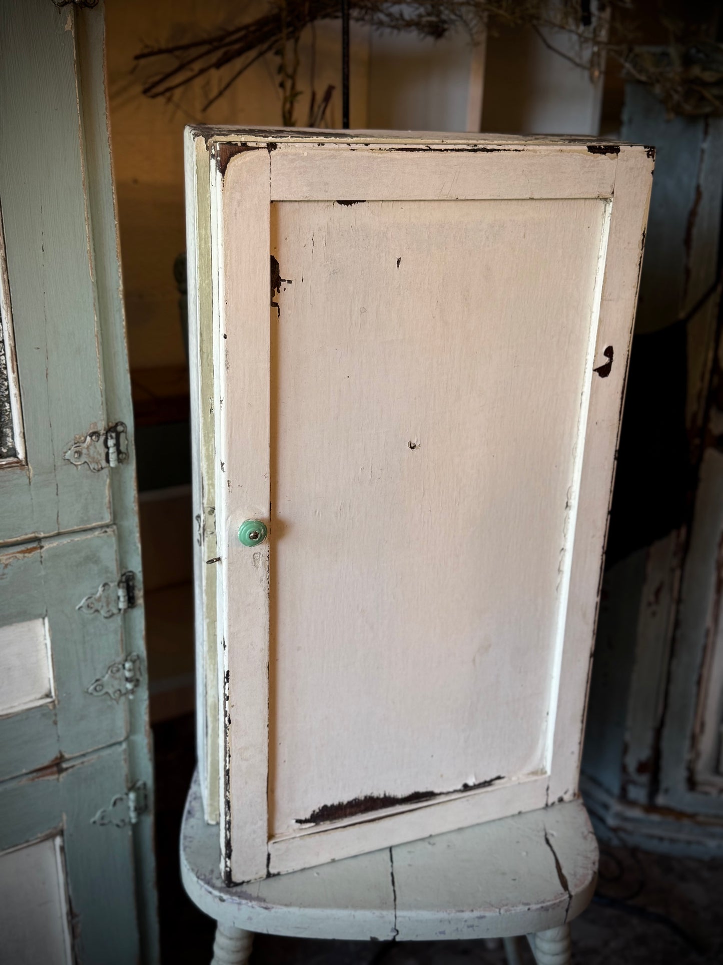 Old White Wall Cabinet with Green Handle