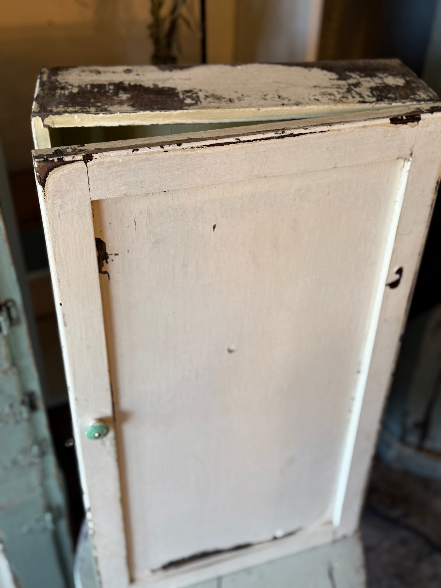 Old White Wall Cabinet with Green Handle