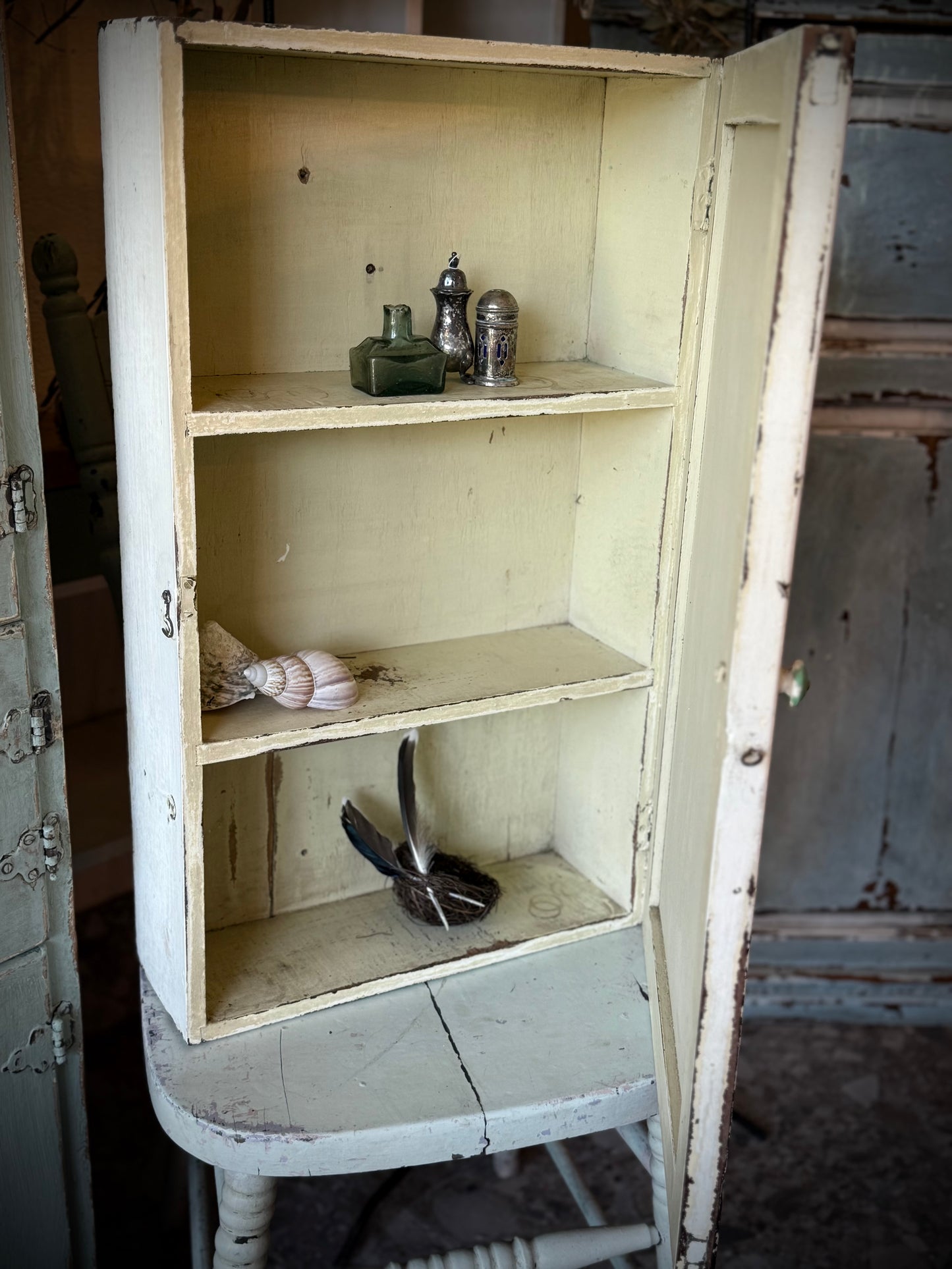 Old White Wall Cabinet with Green Handle