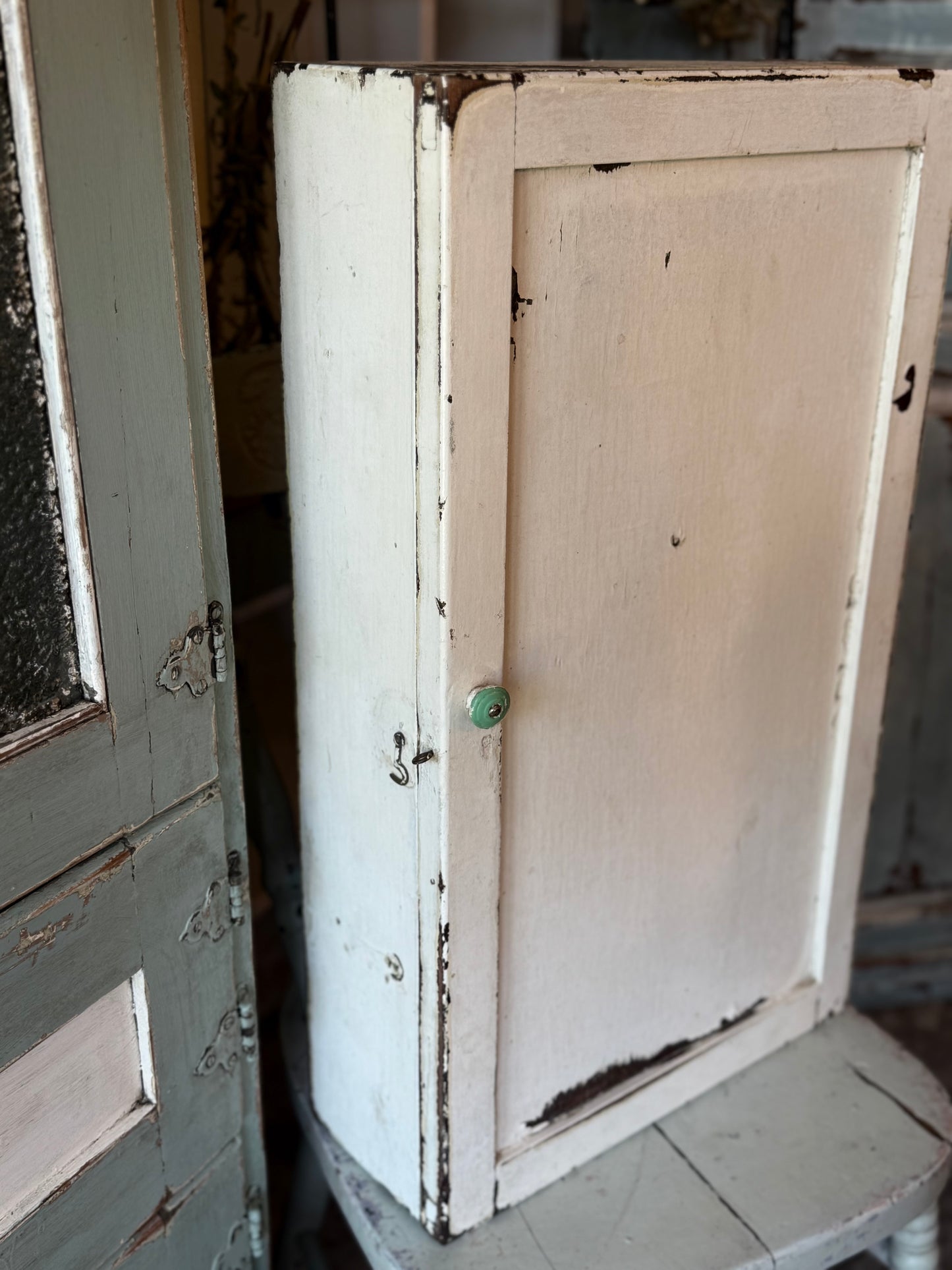 Old White Wall Cabinet with Green Handle